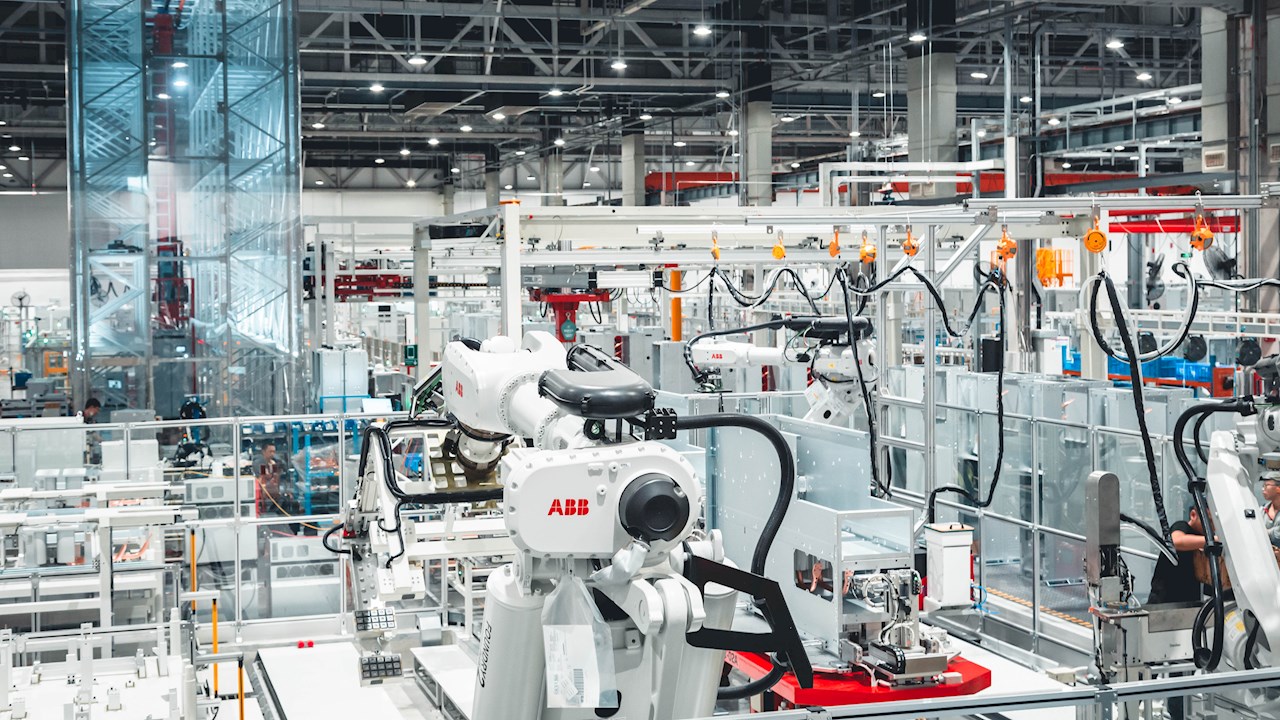 ABB robotic arms in a modern industrial manufacturing facility